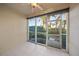 Sunroom with sliding glass doors leading to the backyard at 8369 Wingate Dr # 2114, Sarasota, FL 34238