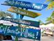 Siesta Key Farmers Market sign with various product listings at 9122 Midnight Pass Rd # 33, Sarasota, FL 34242