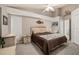 Cozy bedroom with wicker furniture and ceiling fan at 9443 Burnam Dr, Weeki Wachee, FL 34613
