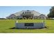 Elegant clubhouse with a welcoming entrance and manicured lawn at 9443 Burnam Dr, Weeki Wachee, FL 34613