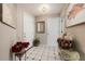 Bright and airy entryway with tile flooring and decorative accents at 9443 Burnam Dr, Weeki Wachee, FL 34613