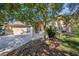 Single-story house with attached garage and landscaped yard at 9443 Burnam Dr, Weeki Wachee, FL 34613