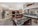 Kitchen with breakfast bar, wood cabinets, and black appliances at 9443 Burnam Dr, Weeki Wachee, FL 34613
