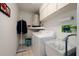 Laundry room with washer, dryer, and utility sink at 9443 Burnam Dr, Weeki Wachee, FL 34613