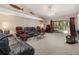 Living room with comfortable seating, high ceilings, and access to the patio at 9443 Burnam Dr, Weeki Wachee, FL 34613