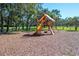 Fun playground with a slide and climbing structure at 9443 Burnam Dr, Weeki Wachee, FL 34613