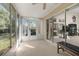 Sunroom with sliding glass doors leading to backyard at 9443 Burnam Dr, Weeki Wachee, FL 34613