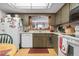 A kitchen featuring white appliances, wood cabinets, and a skylight at 1121 Danny Dr, Sarasota, FL 34243