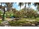 playground with play structures and shaded areas at 1155 Tahiti Pkwy, Sarasota, FL 34236