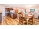 Bright dining area with round wooden table and chairs near kitchen at 11924 Persian Ter, Bradenton, FL 34212