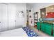 Bedroom with a green dresser and a rustic Texas flag at 12132 Gannett Pl, Lakewood Ranch, FL 34211