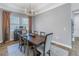 Elegant dining room featuring a wood table and neutral color palette at 12132 Gannett Pl, Lakewood Ranch, FL 34211