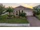 One-story home with brick driveway and landscaping at 12132 Gannett Pl, Lakewood Ranch, FL 34211