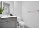 Small bathroom with gray vanity and toilet at 13126 Indigo Way, Bradenton, FL 34211
