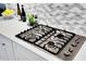 Gas cooktop with modern design in a white kitchen at 13126 Indigo Way, Bradenton, FL 34211