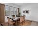 Bright dining room with a wood table and six chairs at 13126 Indigo Way, Bradenton, FL 34211