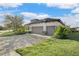 House exterior showcasing a two-car garage and landscaping at 13126 Indigo Way, Bradenton, FL 34211