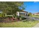 Side view of house with landscaping and a two-car garage at 13126 Indigo Way, Bradenton, FL 34211