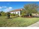 Side yard of the house, showcasing the landscaping at 13126 Indigo Way, Bradenton, FL 34211