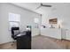 Bright home office with built-in shelving and a large desk at 13126 Indigo Way, Bradenton, FL 34211