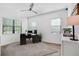 Home office with large desk, ample natural light, and built-ins at 13126 Indigo Way, Bradenton, FL 34211