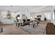 Open concept kitchen with island, stainless steel appliances, and white cabinets at 13126 Indigo Way, Bradenton, FL 34211