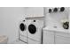 Laundry room with washer, dryer, and cabinets at 13126 Indigo Way, Bradenton, FL 34211