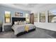 Spacious main bedroom with plush bed and large windows at 13126 Indigo Way, Bradenton, FL 34211