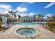 Community pool and spa with lounge chairs at 13126 Indigo Way, Bradenton, FL 34211