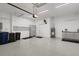 Spacious garage features a clean epoxy floor, ample storage cabinets, and functional organization racks at 13789 Old Creek Ct, Parrish, FL 34219
