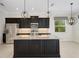 Open kitchen featuring an island, stainless steel appliances, and granite countertops at 13789 Old Creek Ct, Parrish, FL 34219