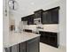 Modern kitchen featuring an island, granite countertops, and stainless steel appliances at 13789 Old Creek Ct, Parrish, FL 34219