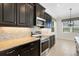Updated kitchen featuring stainless steel appliances and granite countertops with tile backsplash at 13789 Old Creek Ct, Parrish, FL 34219
