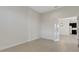 Bright living room area with neutral tile flooring, bright white walls, and clear sight lines to other rooms at 13789 Old Creek Ct, Parrish, FL 34219