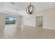 Spacious living room with tile floors, sliding glass doors to the outside, and recessed lighting, ideal for entertaining at 13789 Old Creek Ct, Parrish, FL 34219