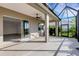 Covered patio with ceiling fan and sliding glass doors opening to the main house at 13789 Old Creek Ct, Parrish, FL 34219