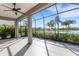 Screened patio with beautiful views of lush landscaping and a tranquil lake at 13789 Old Creek Ct, Parrish, FL 34219