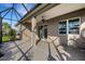 Back patio with views of the backyard and lush landscape at 13789 Old Creek Ct, Parrish, FL 34219