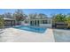 Relaxing rectangular pool, spa, and ample patio space at 1518 Stoeber Ave, Sarasota, FL 34232