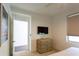 Bedroom with a dresser and a ceiling fan at 1709 N Tamiami Trl # 212, Sarasota, FL 34234