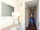 Bright condo entryway with mirror, console table, and hardwood floors at 1709 N Tamiami Trl # 212, Sarasota, FL 34234