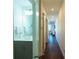 Hallway with barn door and access to bedrooms at 1709 N Tamiami Trl # 212, Sarasota, FL 34234