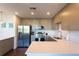 Modern kitchen with stainless steel appliances and white quartz countertops at 1709 N Tamiami Trl # 212, Sarasota, FL 34234
