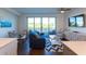 Bright living room with water views and stylish decor at 1709 N Tamiami Trl # 212, Sarasota, FL 34234