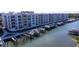 Modern building, boat docks and walkway along the canal at 1709 N Tamiami Trl # 212, Sarasota, FL 34234