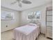 Bedroom featuring carpeted floors, a single bed, wicker furniture, and windows with blinds at 1725 Pocatello St, Sarasota, FL 34231