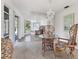 Dining room with wicker chairs, glass table, and large mirror at 1725 Pocatello St, Sarasota, FL 34231