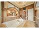 Spa-like bathroom with a soaking tub and walk-in shower at 275 Lookout Point Dr, Osprey, FL 34229