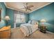 Comfortable bedroom with a queen bed and a ceiling fan at 275 Lookout Point Dr, Osprey, FL 34229