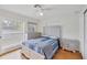 Cozy bedroom with a queen-size bed and light-colored dresser at 2832 Novus St, Sarasota, FL 34237